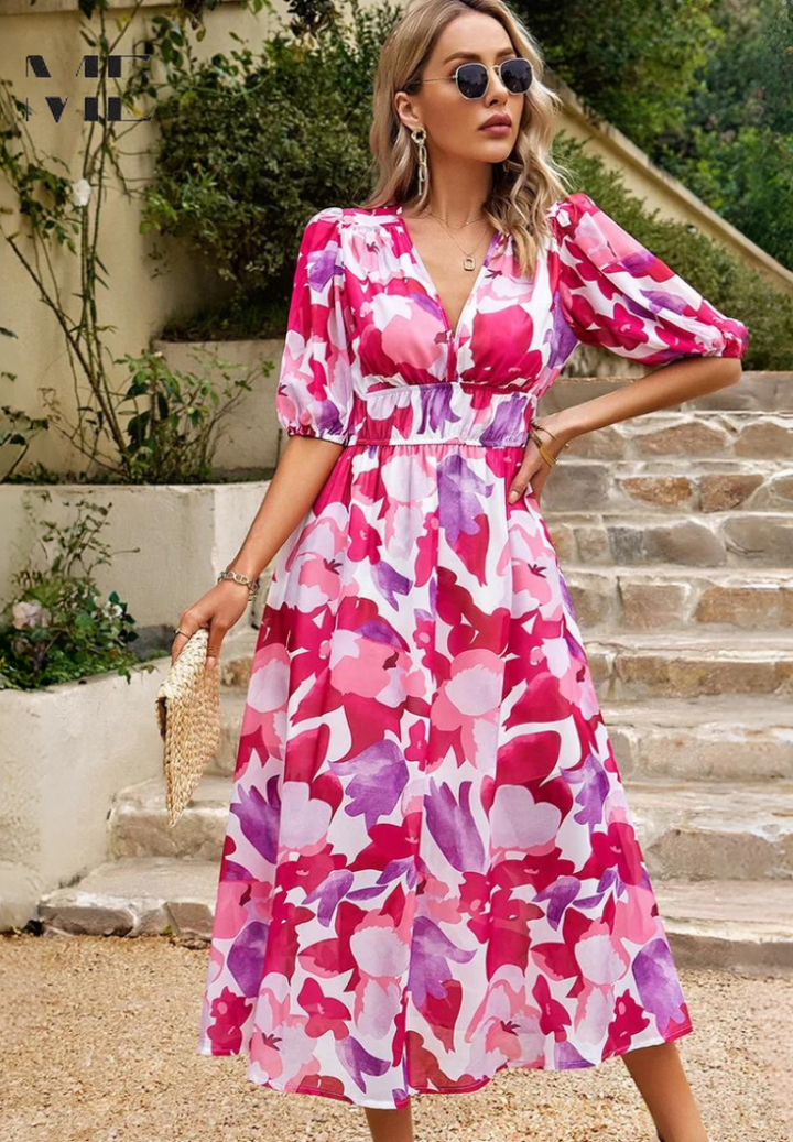 Women's stylish floral midi dress with puff sleeves & V-neck, ready for any elegant summer occasion.