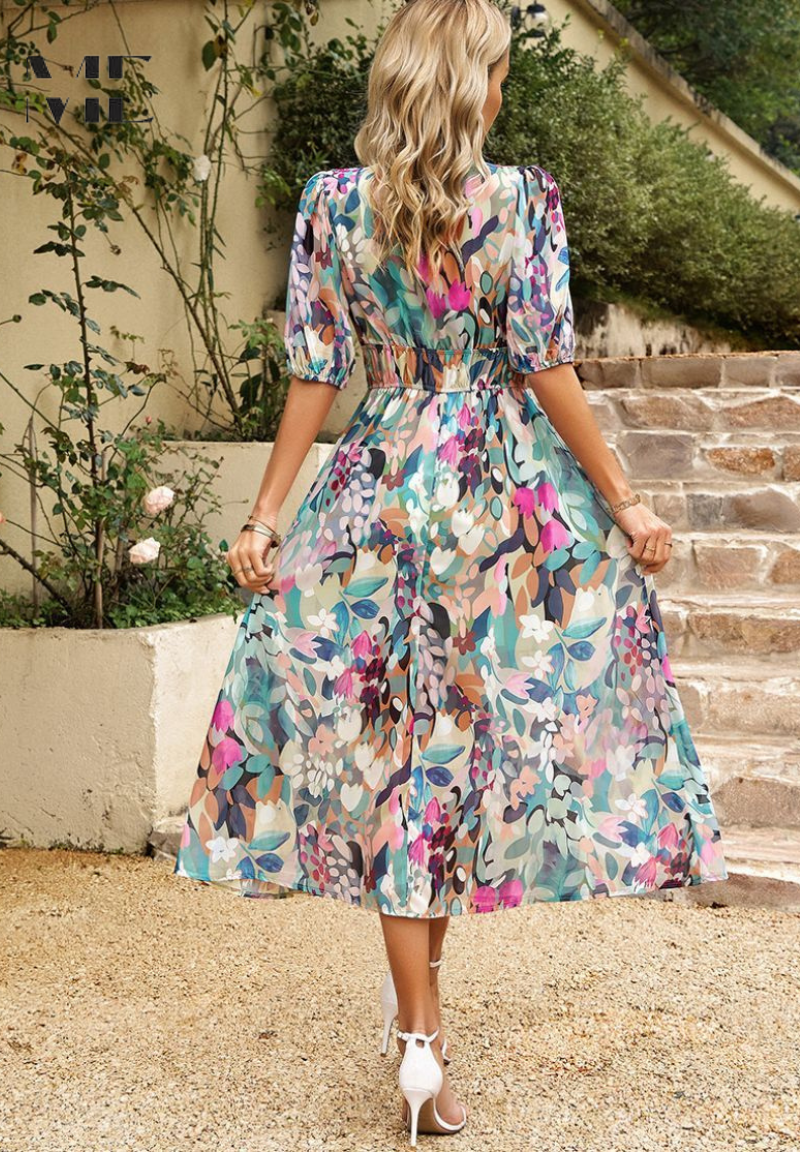 Flowy floral midi dress, ideal for summer parties. Elegant V-neck and delicate puff sleeves for women.