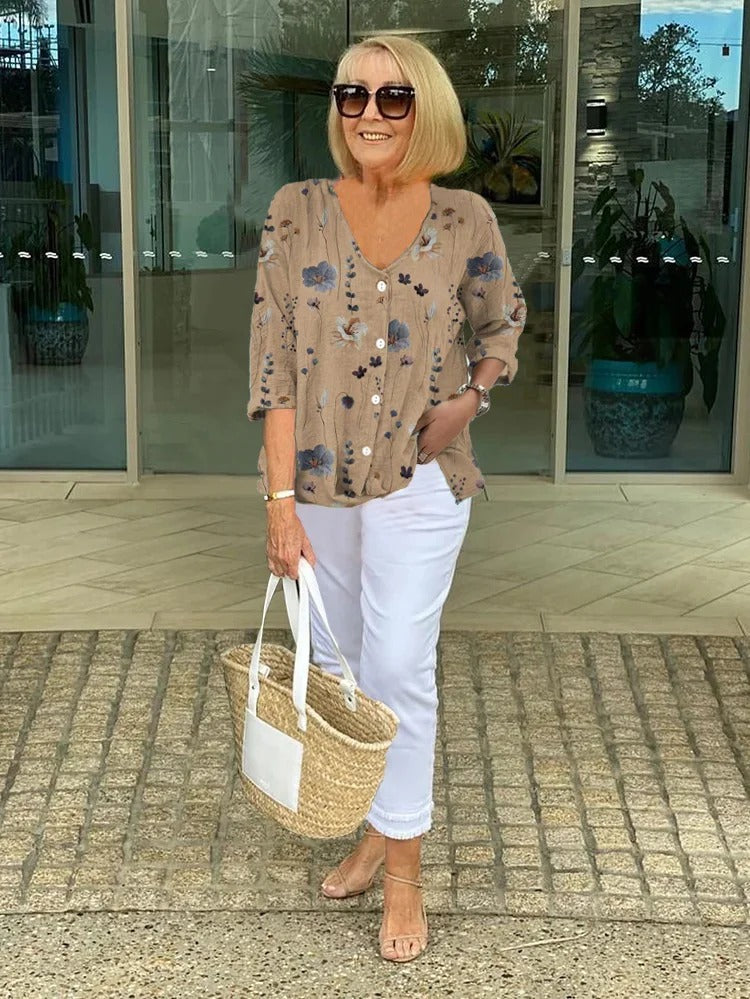 Comfortable women's blouse featuring a vibrant floral print, ideal for everyday wear.
