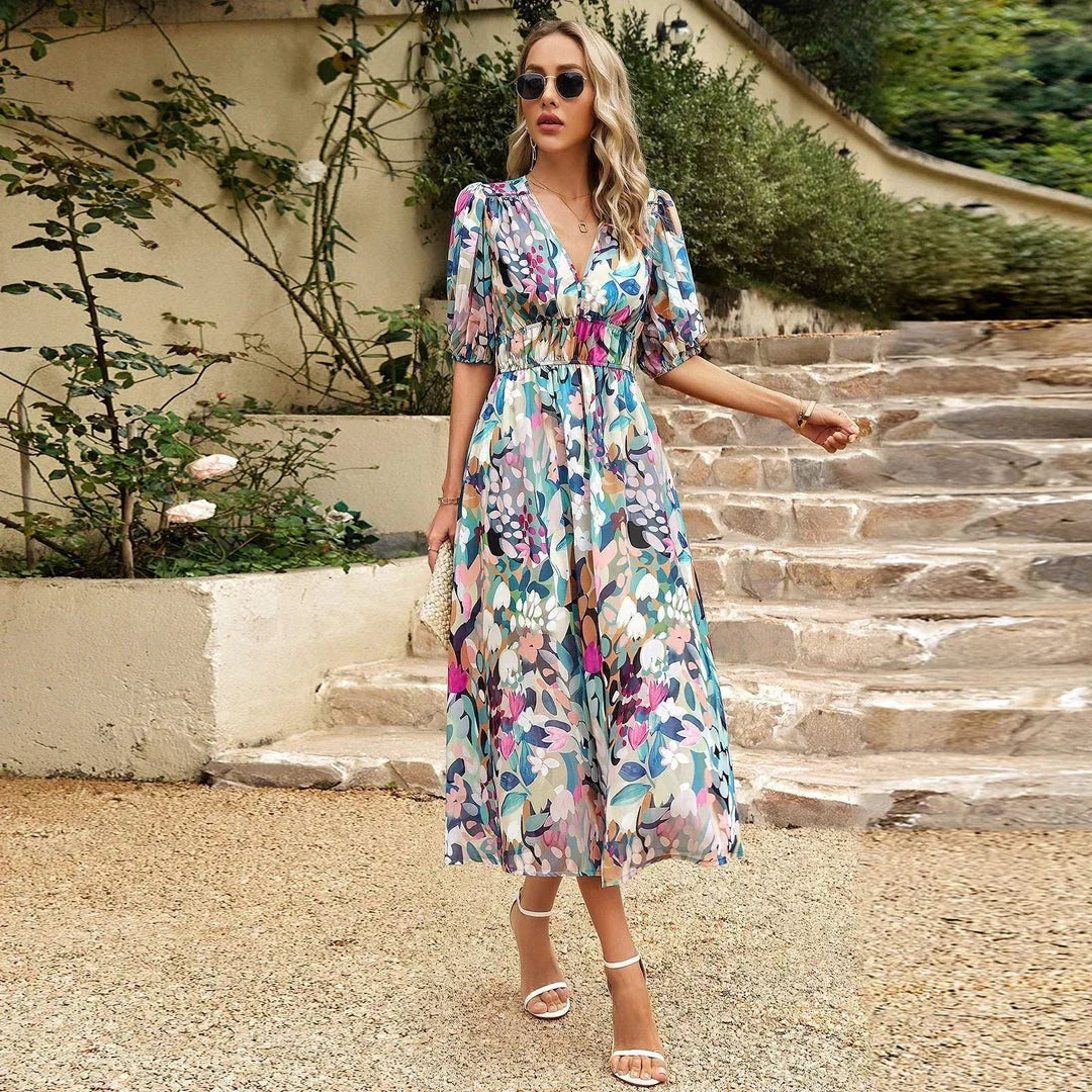 Beautiful women's floral print midi dress, elegant and flowing, essential summer wear for a chic garden party look.