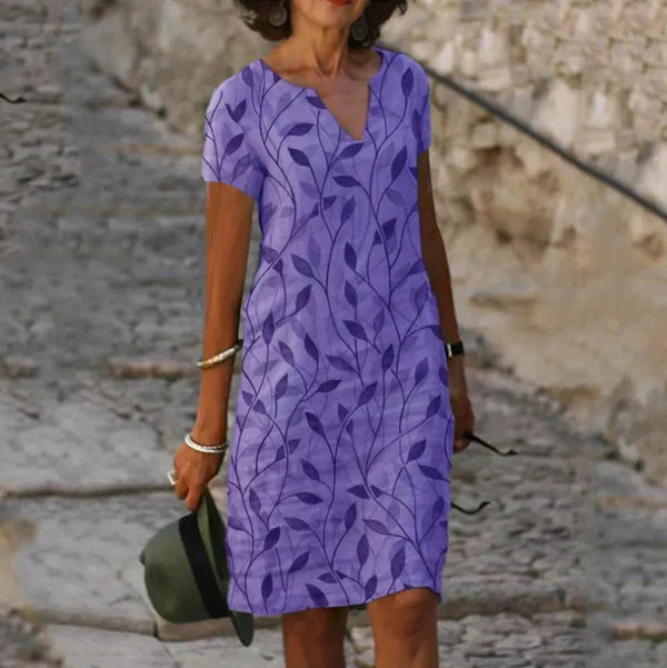 Flattering women's travel vacation dress. Elegant flowing maxi style, comfortable and versatile for summer resort wear.