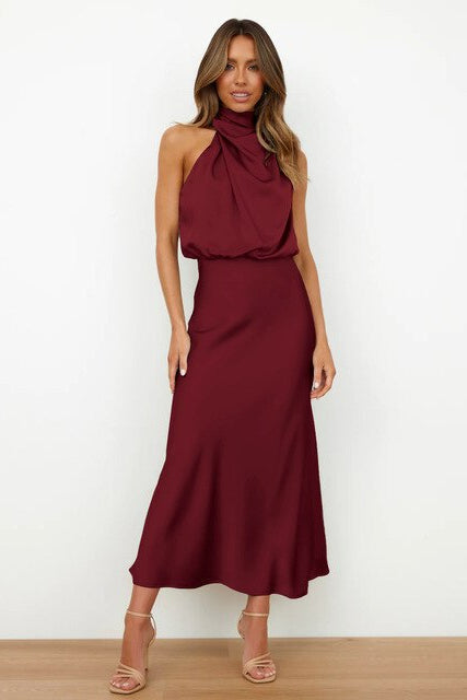 Fashionable midi dress with a chic halter neckline, ideal for formal gatherings