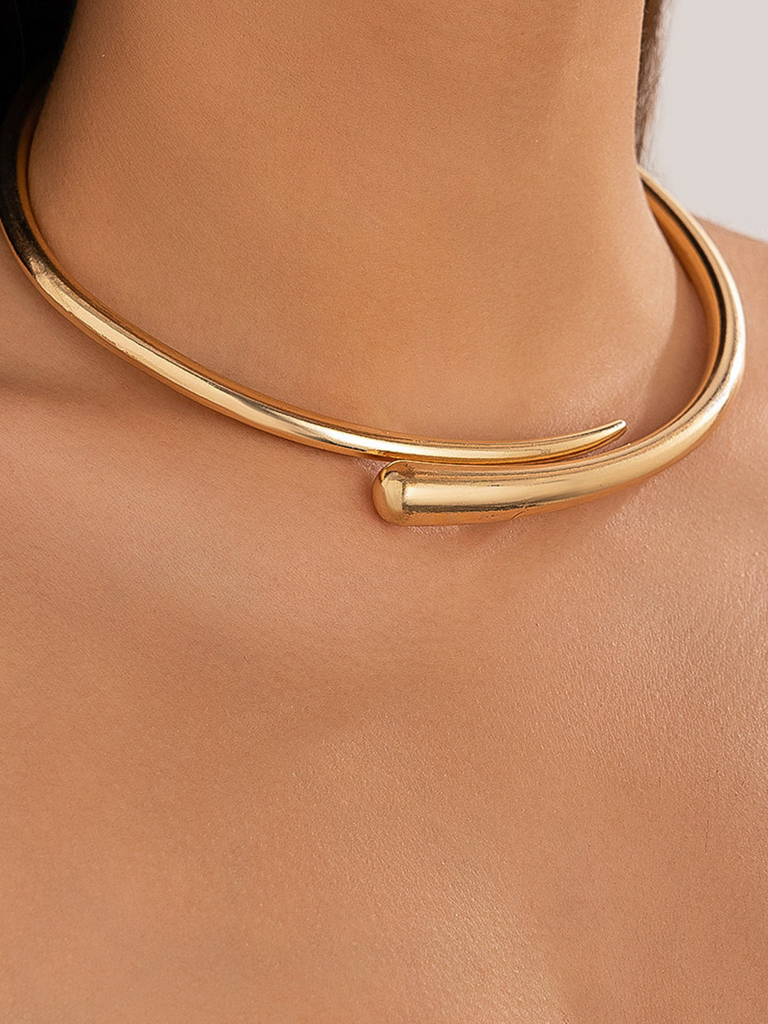Minimalist women's gold water drop open choker. This elegant gold-tone necklace is a perfect fashion accessory.
