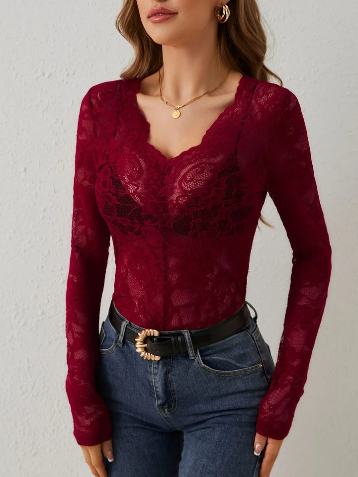 Versatile women's fashion: a chic lace blouse perfect for daytime or evening wear.