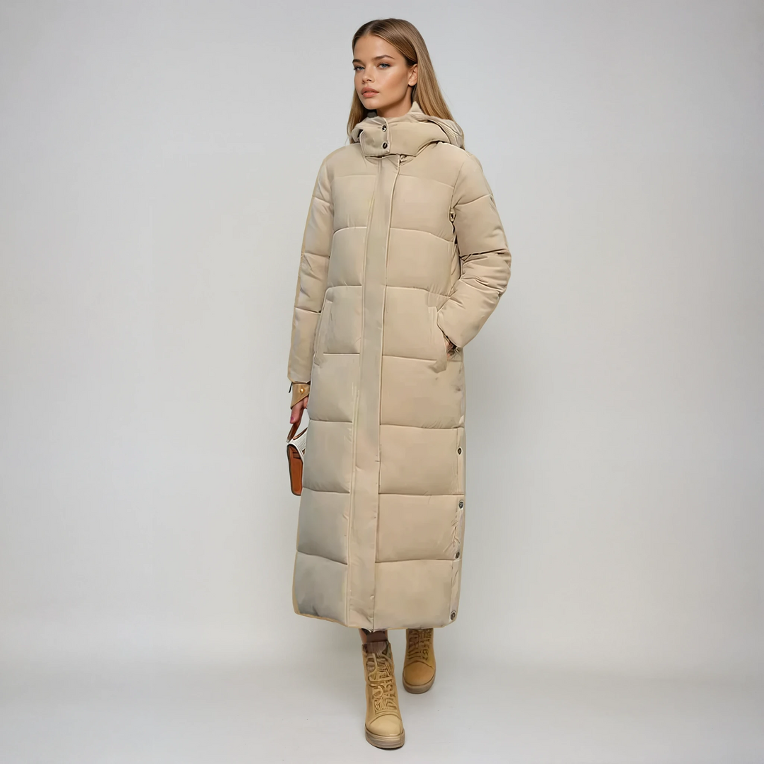 Elegant women's long black puffer coat for winter, warm & stylish outerwear, perfect for cold weather fashion.