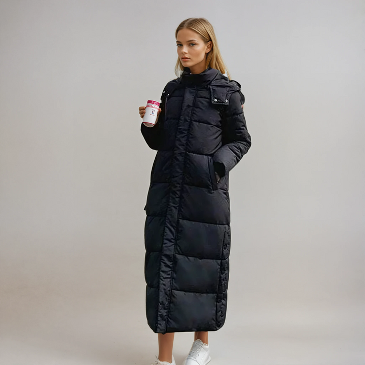 Cozy women's long puffer coat, ideal for winter warmth & cold weather travel. Stylish everyday outerwear.