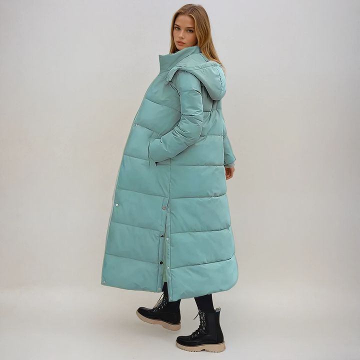 Stylish women's long puffer coat, elegant design for ultimate winter warmth & protection from cold weather.