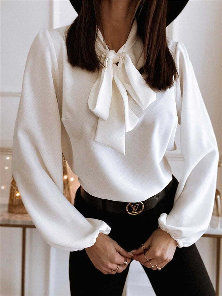 Sophisticated women's long sleeve top, an elegant blouse with bow, ideal for office and chic fashion.