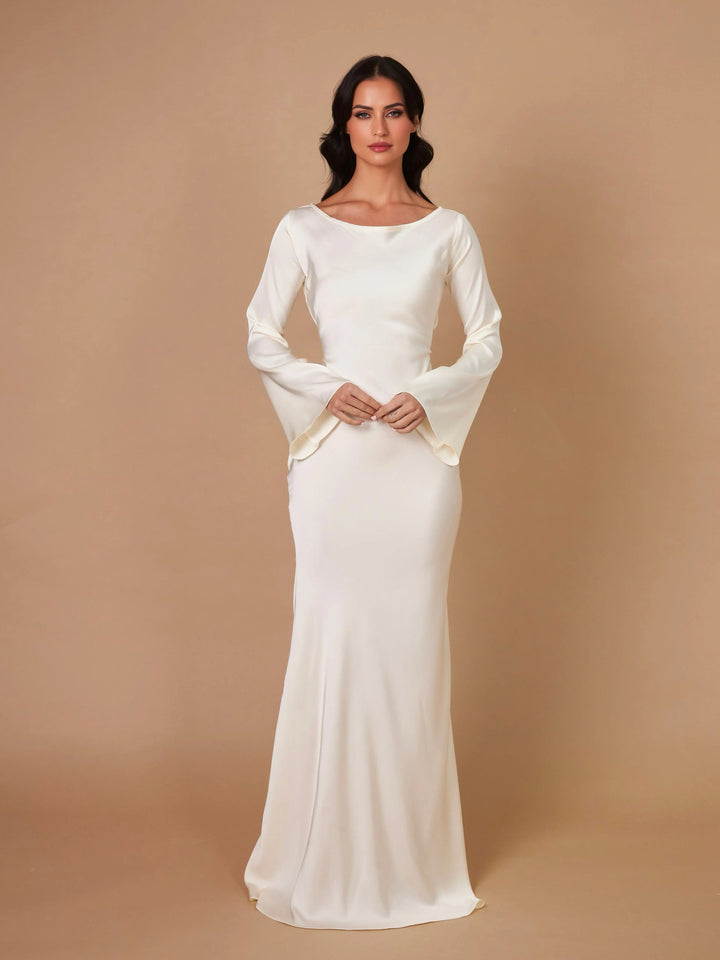 Side profile of a graceful long sleeve maxi dress, highlighting its elegant design.
