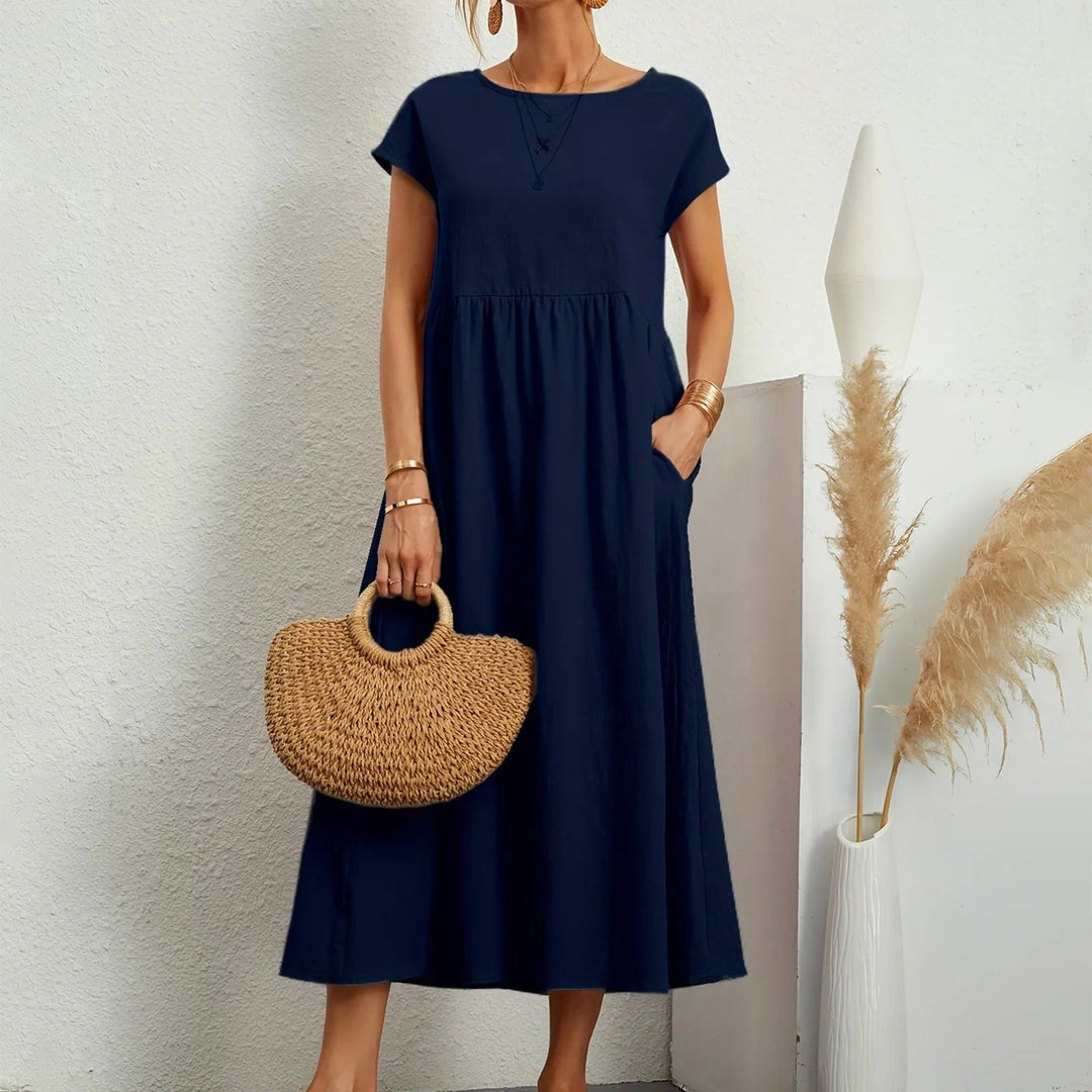 Women's elegant midi dress for versatile occasion wear. Comfortable, flattering, and classic day-to-night fashion.