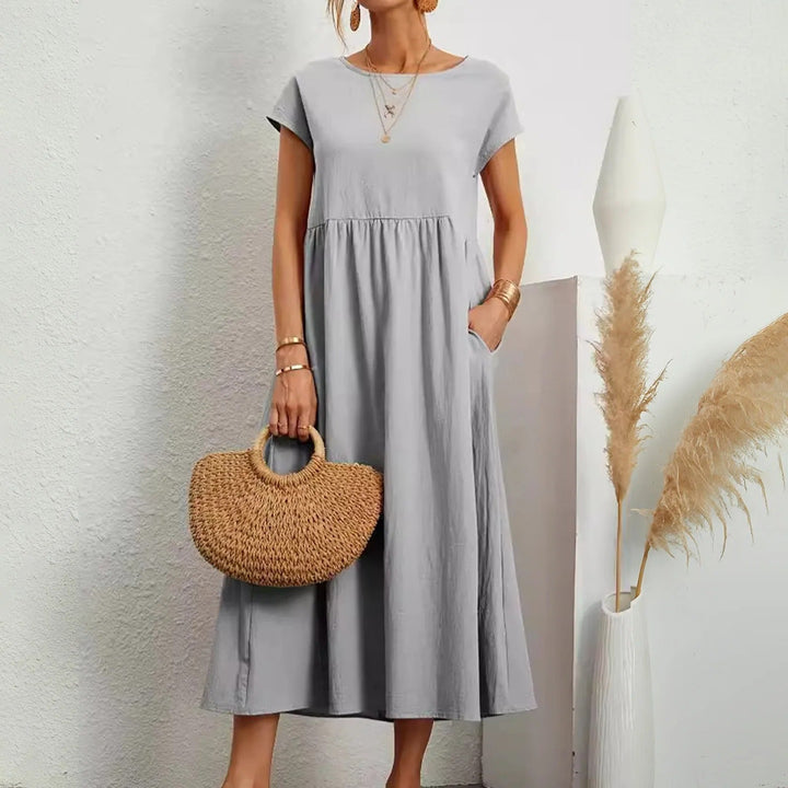 Versatile women's midi dress, effortless elegant style with a flattering fit for day-to-night occasions.