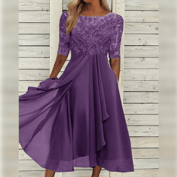 Sophisticated women's midi dress with an elegant lace bodice, flowy skirt, and a flattering silhouette.