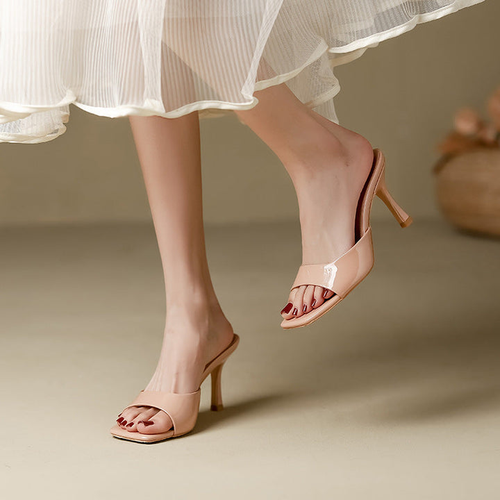 Elegant women's open toe slip-on mules with a stylish square heel. Perfect for summer fashion.