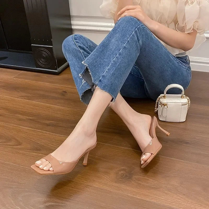 Women's open toe slip-on mules with a square heel, a versatile choice for elegant everyday wear.