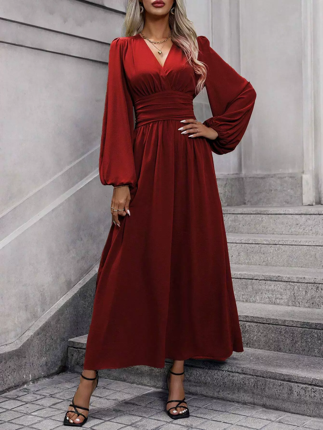 Women's beautiful pink long sleeve midi dress featuring a leg slit, ideal for a cocktail or evening party.