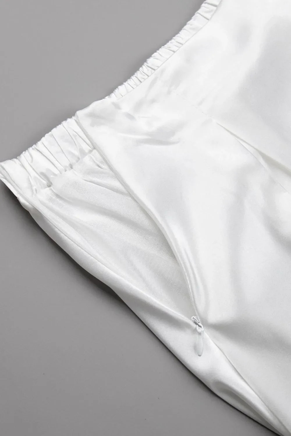 The smooth texture of a women's satin maxi skirt, highlighting its quality