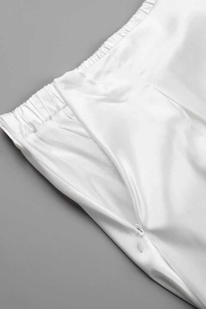 The smooth texture of a women's satin maxi skirt, highlighting its quality