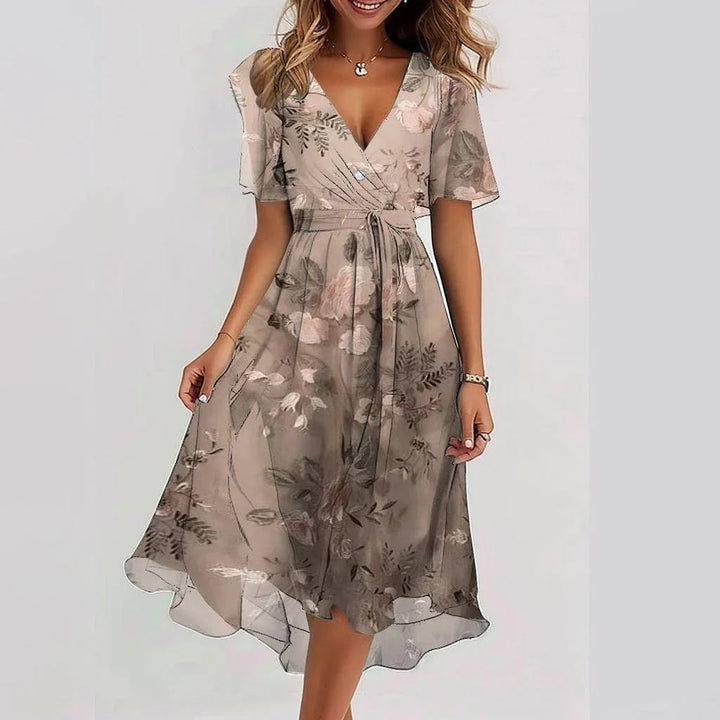 Women's elegant summer midi dress, offering effortless style and comfort. Perfect for vacation or sophisticated day wear.