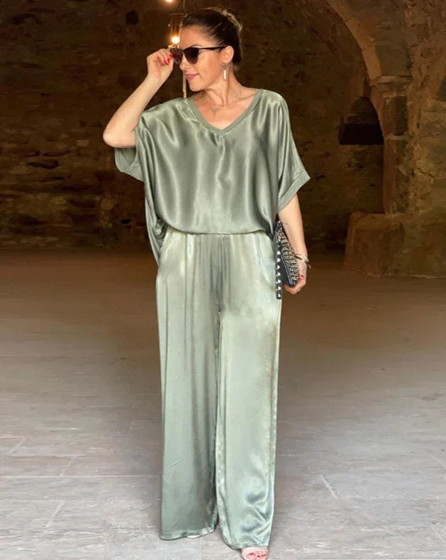 Elegant women's two-piece top & pants set for professional wear or chic spring fashion. Tailored & comfortable matching set.