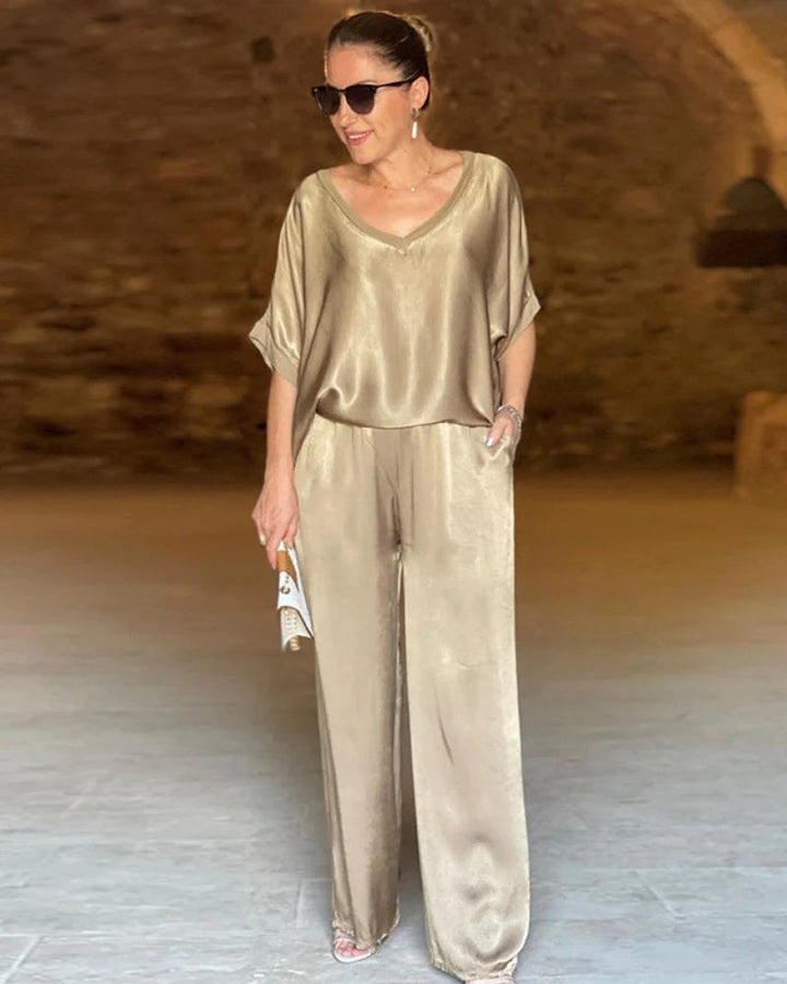 Chic women's matching top and pants set. Versatile elegant outfit perfect for office, professional or spring fashion.