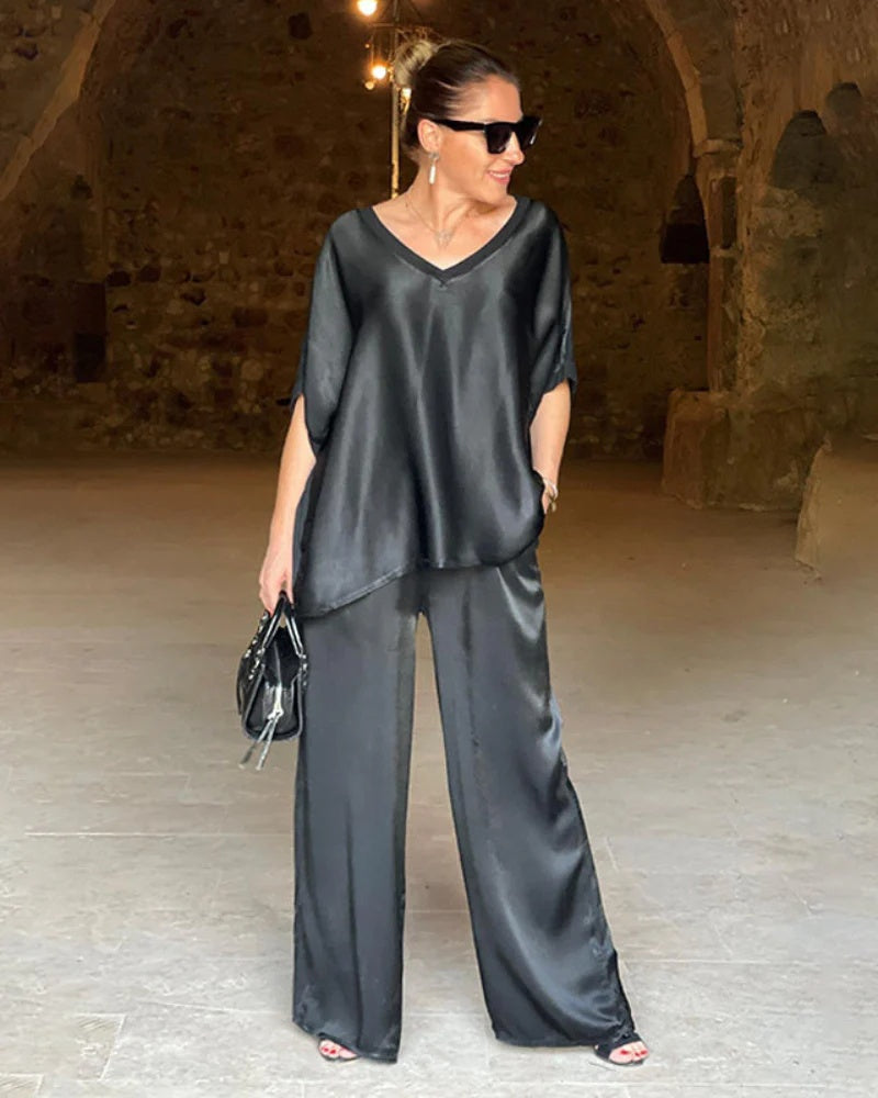 New elegant women's two-piece set, featuring a stylish top and comfortable tailored pants. Perfect for professional women.