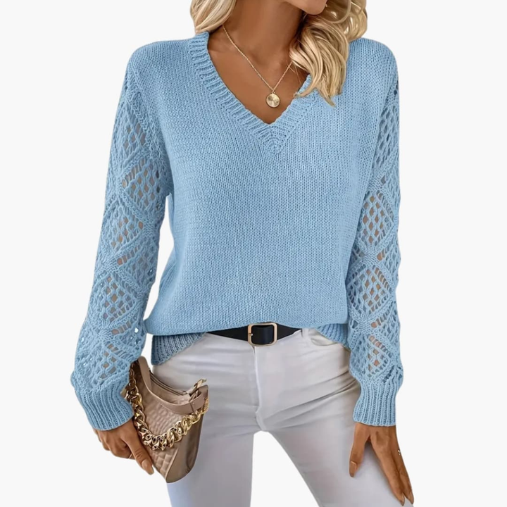Women's chic V-neck long sleeve pullover. Soft, textured knit top, perfect for casual and elegant layering.
