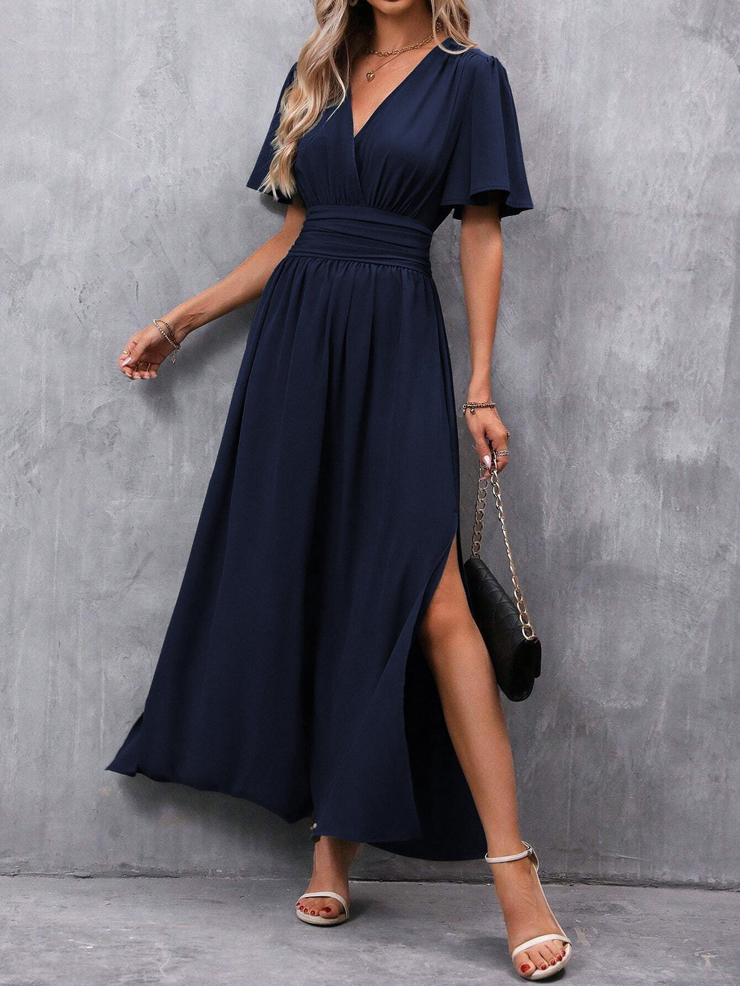 Women's elegant maxi dress featuring a V-neck, flutter sleeves, and empire waist. Ideal for summer or parties.