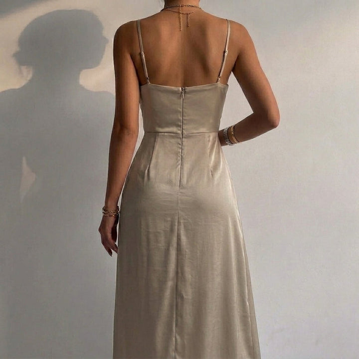 Women's elegant midi length party dress with a plunging V-neck and slit accent.
