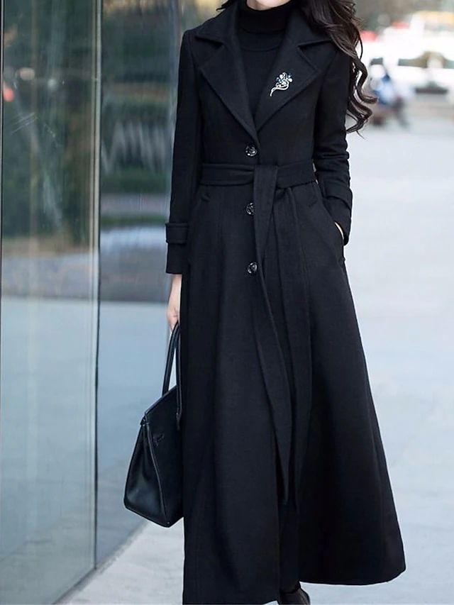 Long women's winter coat with a stylish shawl collar, combining warmth, elegance, and modern fashion.