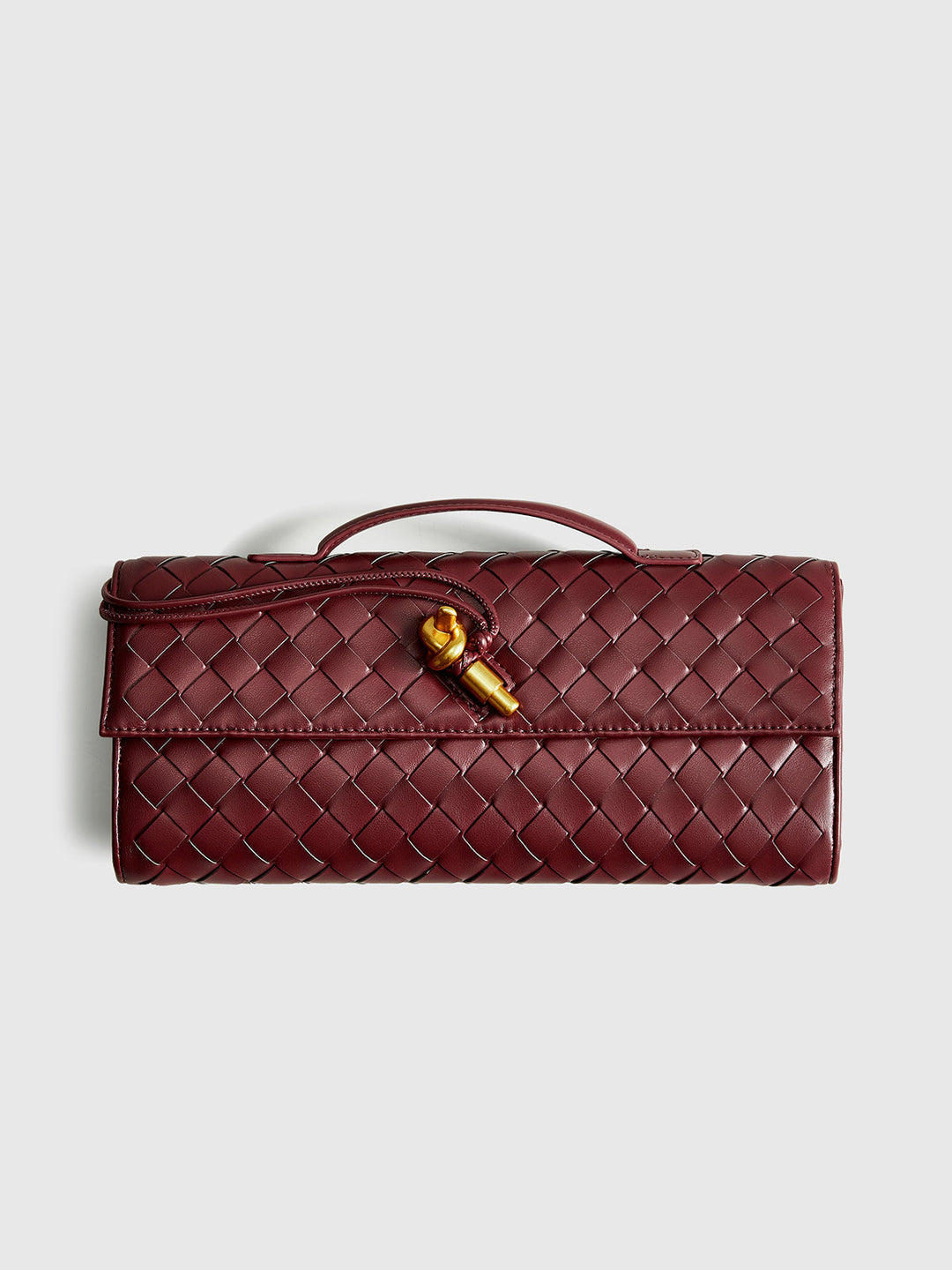 Chic woven texture clutch with secure flap closure, a stylish women's evening purse.