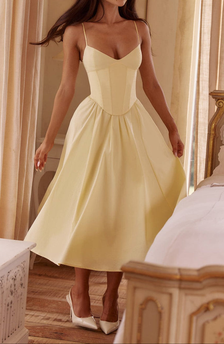 Elegant yellow corset midi dress for women. Features A-line skirt, spaghetti straps. Perfect formal or wedding guest dress.