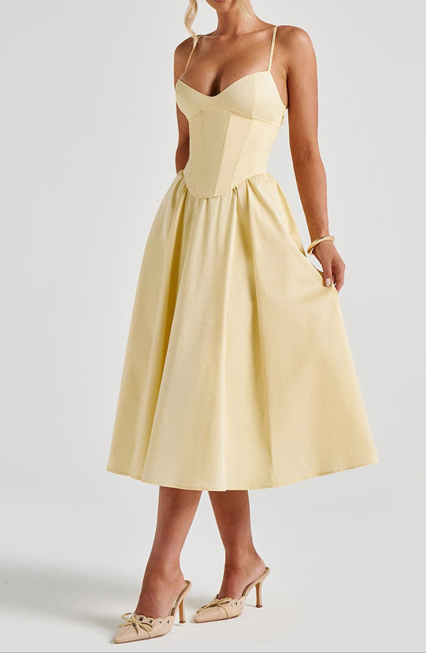 Stunning yellow spaghetti strap corset midi dress. Elegant A-line formal gown, ideal women's wedding guest or cocktail wear.