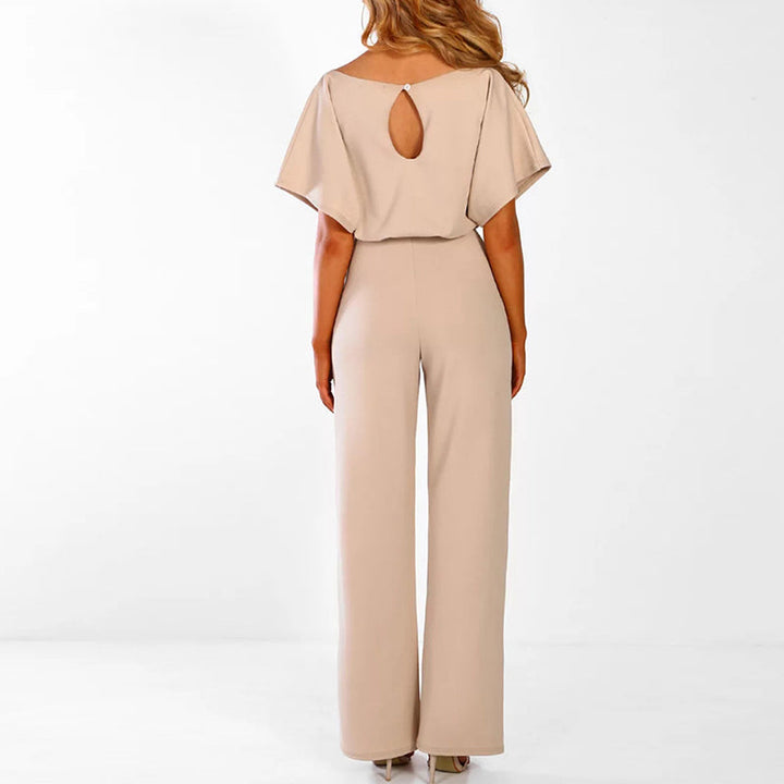 Stylish women's wide-leg jumpsuit, features a flattering tie-waist. Versatile for dressy or casual wear.