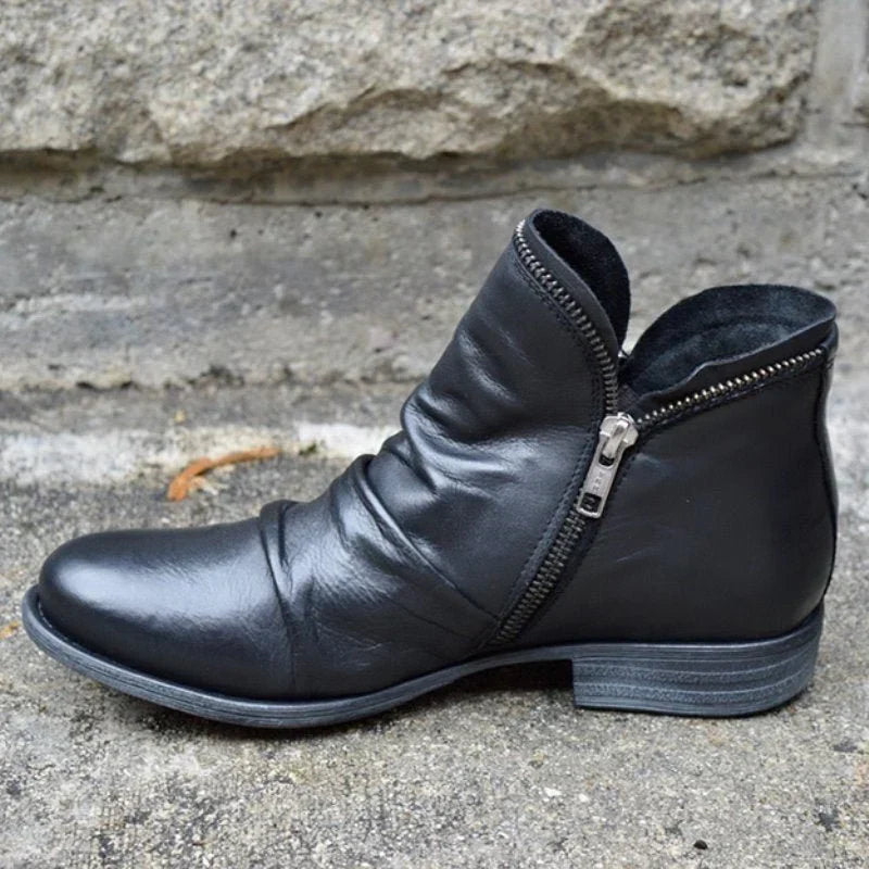 Women's orthopedic ankle boots with elegant ruffle detail & side-zip. Comfortable, stylish for everyday wear.
