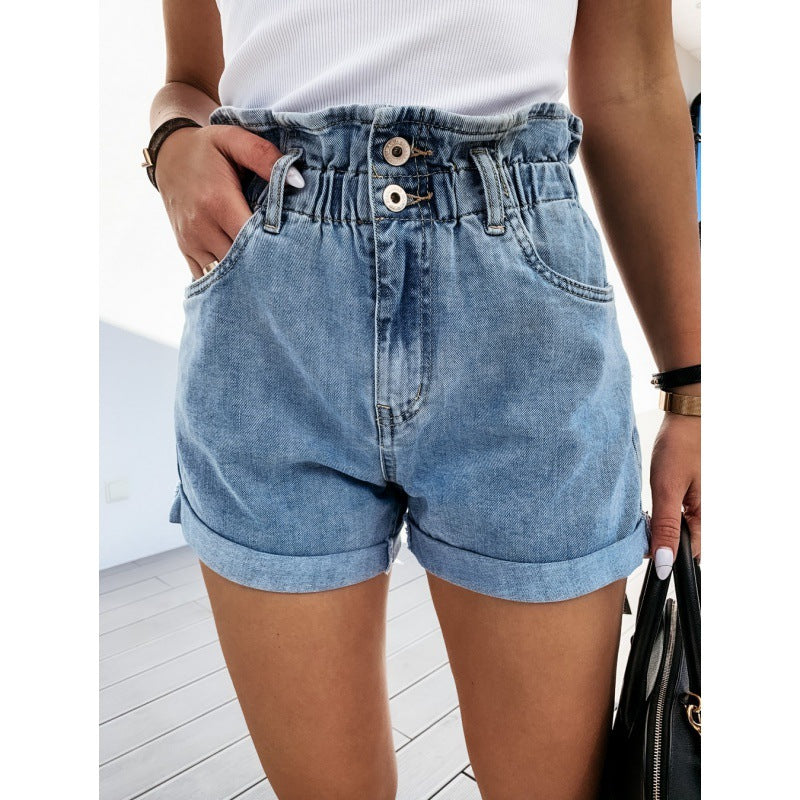 Polished women's high-waisted roll-cuff denim shorts in light blue. Versatile for casual summer fashion.