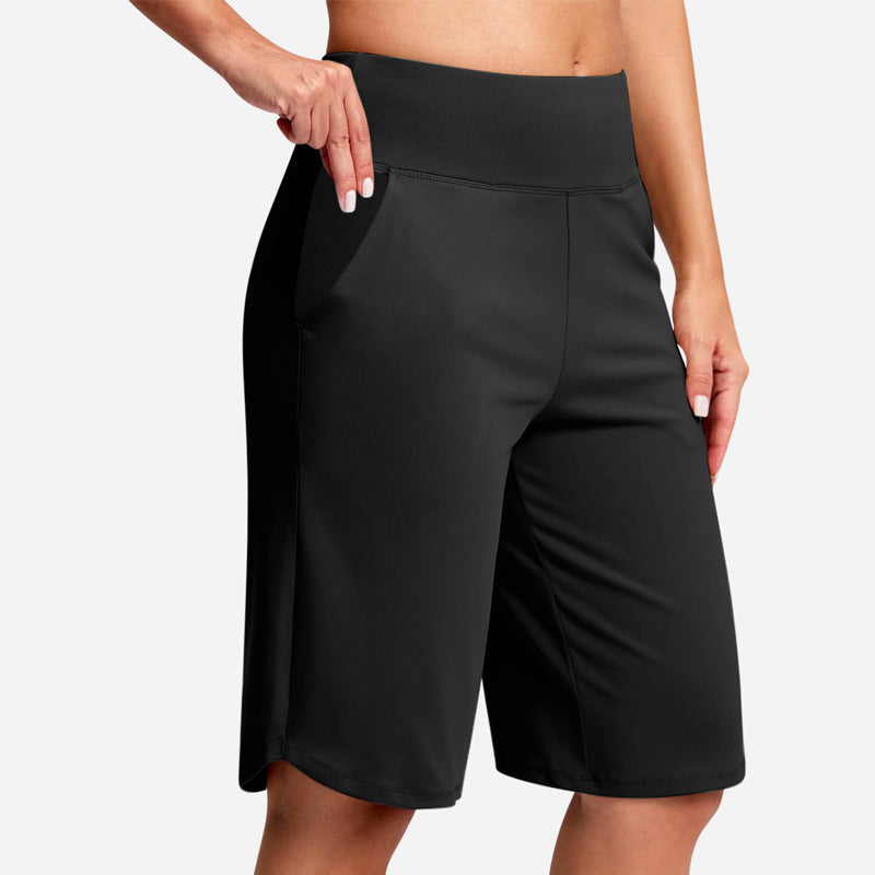 Black high waist pocket bike shorts for women, offering sleek style & comfortable activewear support.