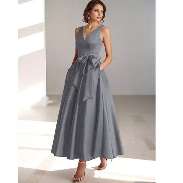 Timeless women's V-neck pleated midi dress, an essential for your occasion wardrobe.