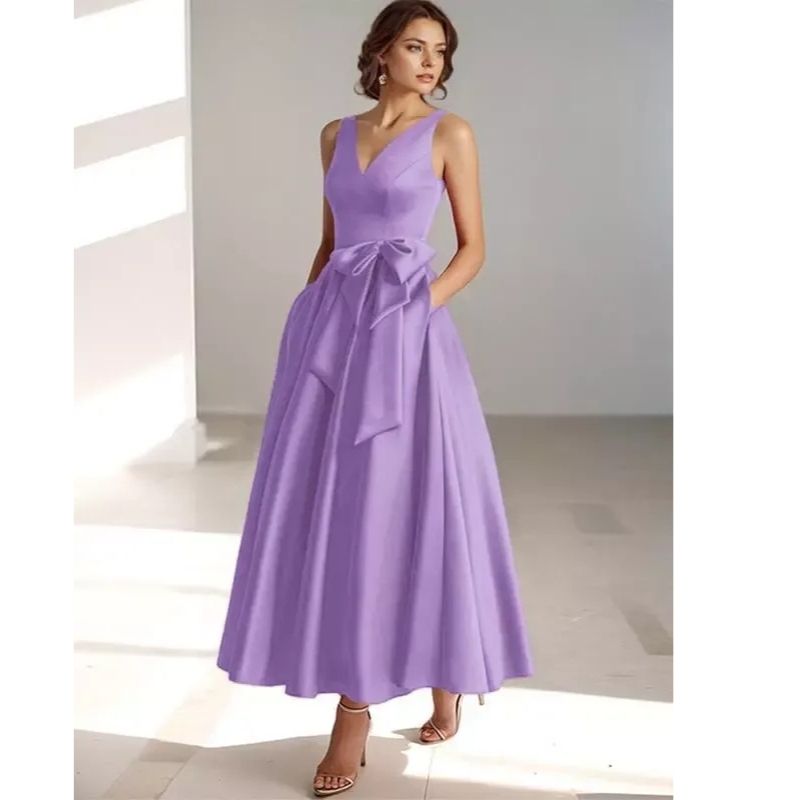 Feminine pleated A-line V-neck midi dress, perfect for spring/summer events.