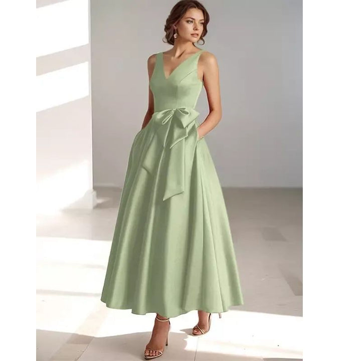 Sophisticated women's V-neck midi dress with pleats, designed for race day elegance.