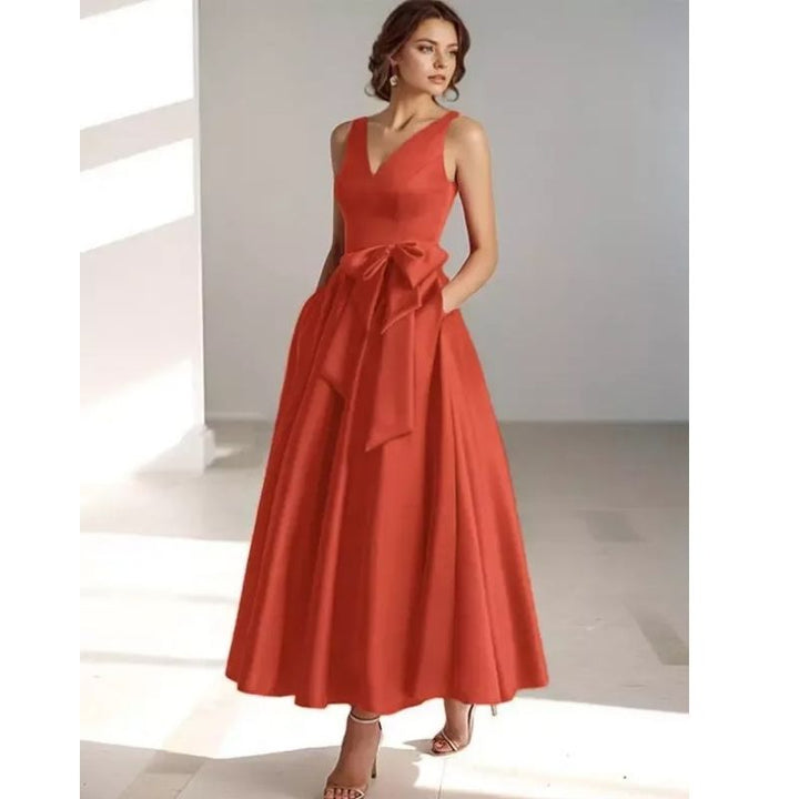 Graceful pleated V-neck A-line midi dress for women, ideal for warm weather occasions.