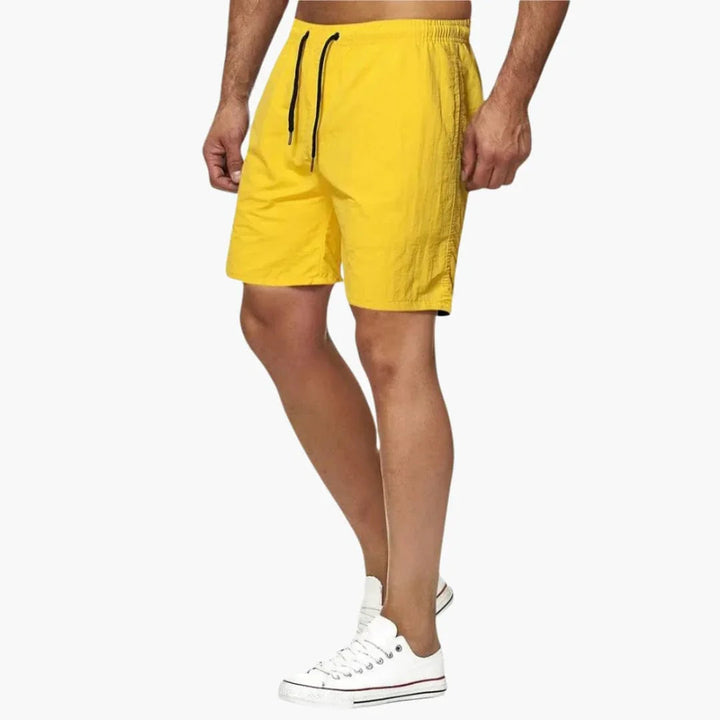 Performance men's quick-dry swim shorts with adjustable drawstring, ideal for beachwear & active summer.