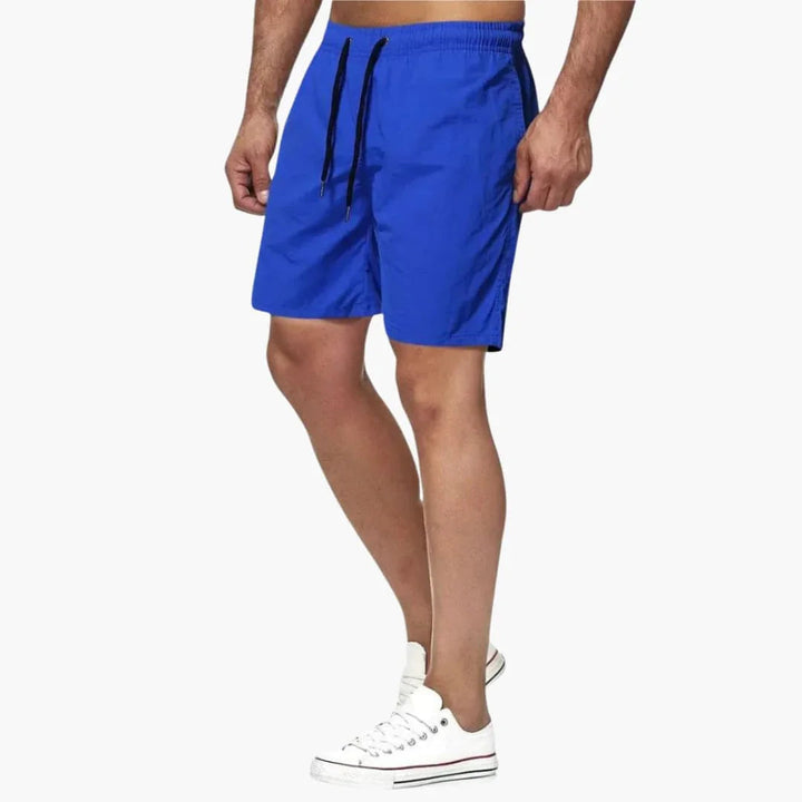 Comfortable men's quick-dry swim shorts featuring a secure drawstring closure. Great for summer activities.