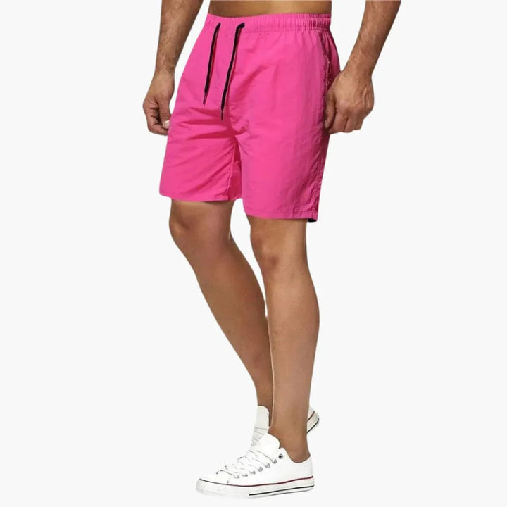 Modern men's quick-dry swim shorts with functional drawstring. Essential beachwear for summer style.