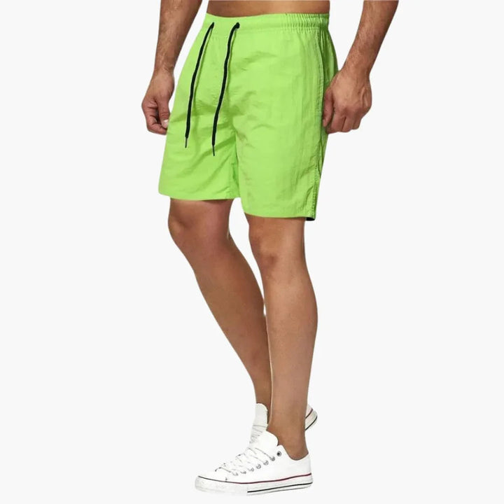 Comfortable & stylish men's quick-dry drawstring swim shorts. Perfect for resortwear and summer beach days.