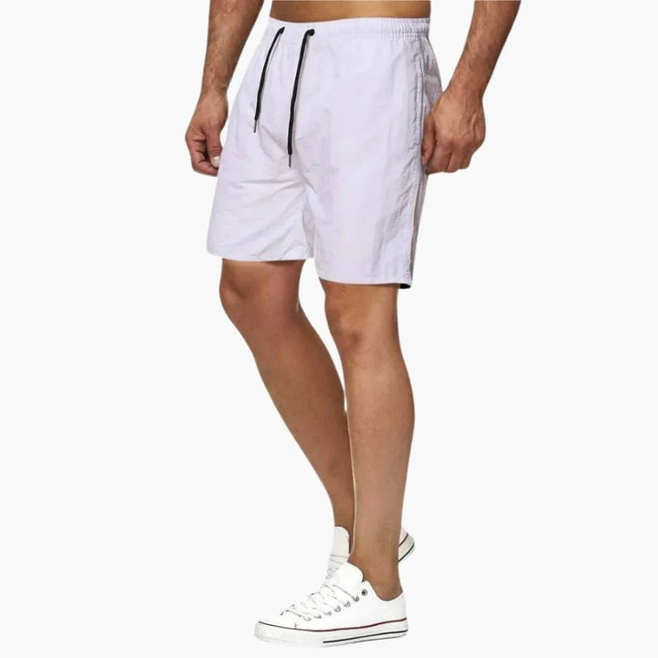 Premium men's quick-dry drawstring swim shorts. Durable beachwear & active resortwear for summer adventures.