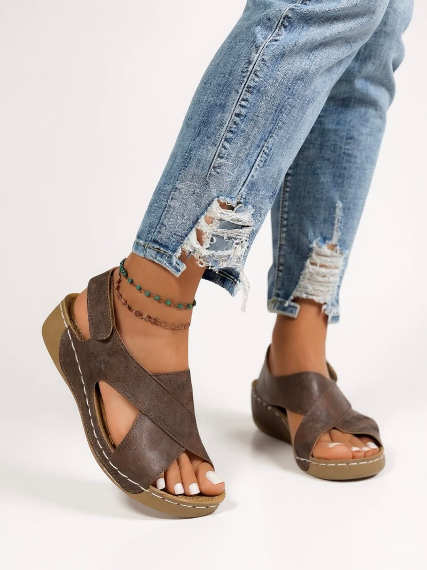 Summer-ready women's footwear: chic cross strap platform wedge sandals.