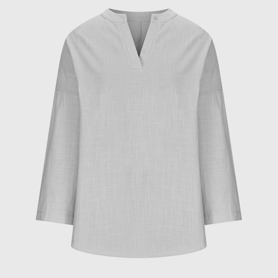 Long sleeve V-neck tunic shirt for women, comfortable & relaxed for casual outings or beach days.