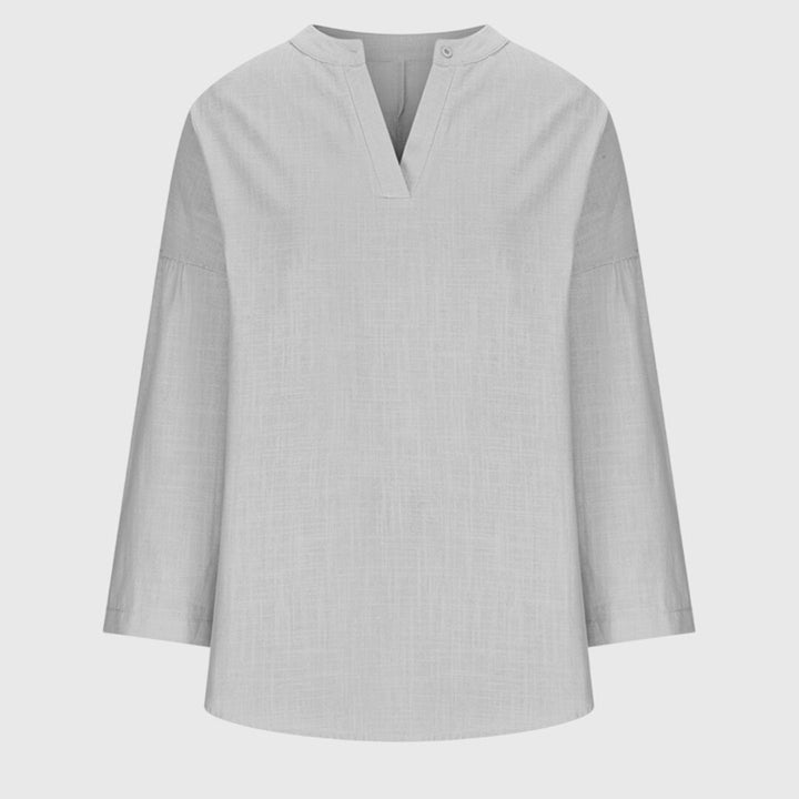 Long sleeve V-neck tunic shirt for women, comfortable & relaxed for casual outings or beach days.