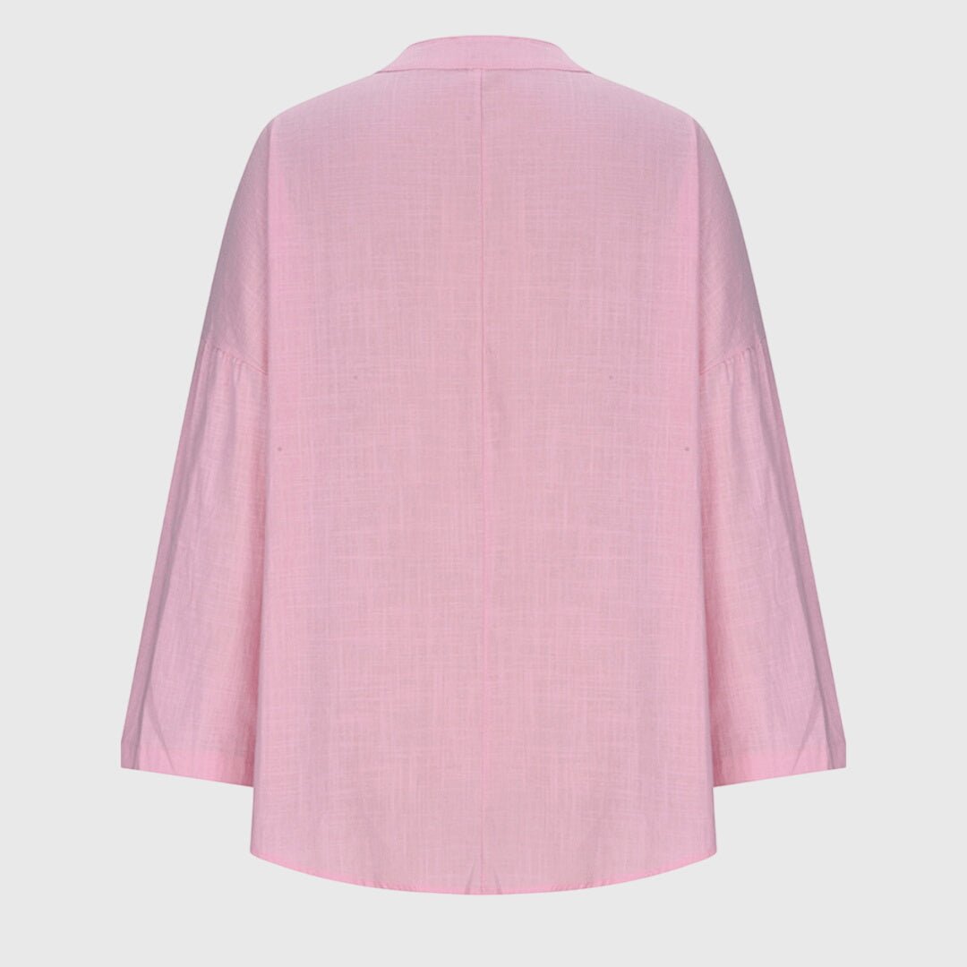 Elegant women's V-neck tunic shirt with relaxed long sleeves, designed for comfort & everyday wear.