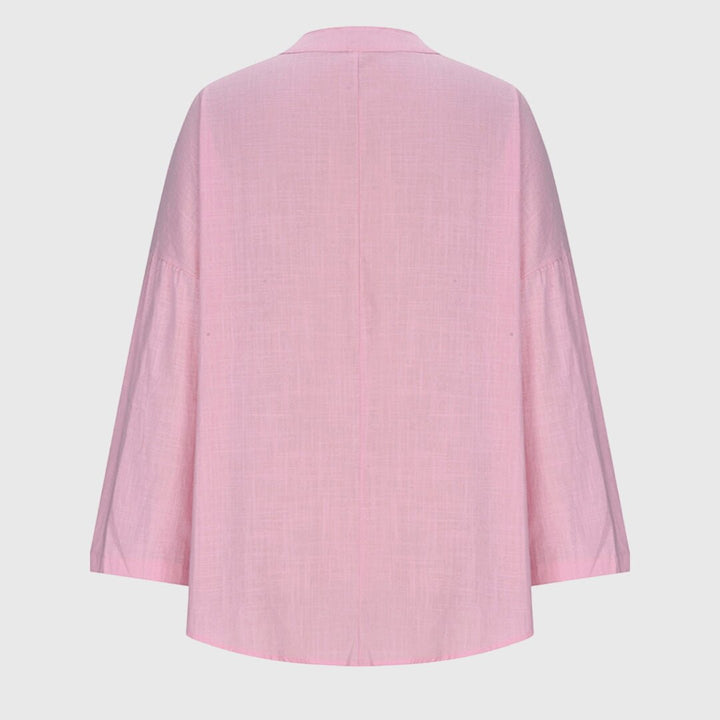 Elegant women's V-neck tunic shirt with relaxed long sleeves, designed for comfort & everyday wear.